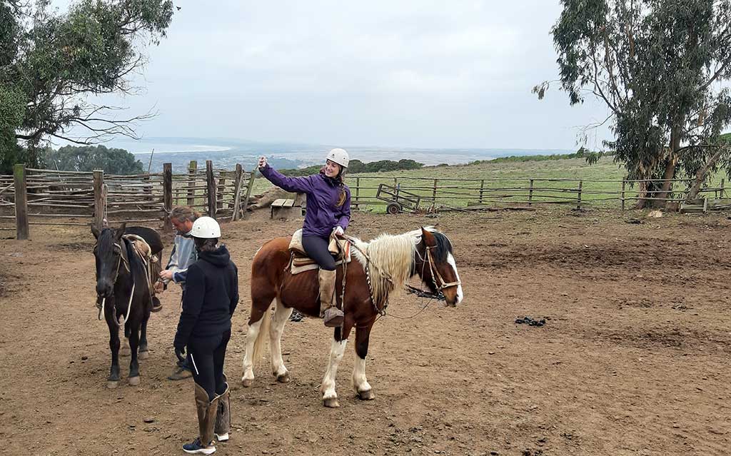At the corral getting ready for horseback ride on beach and sand dunes in Mantagua