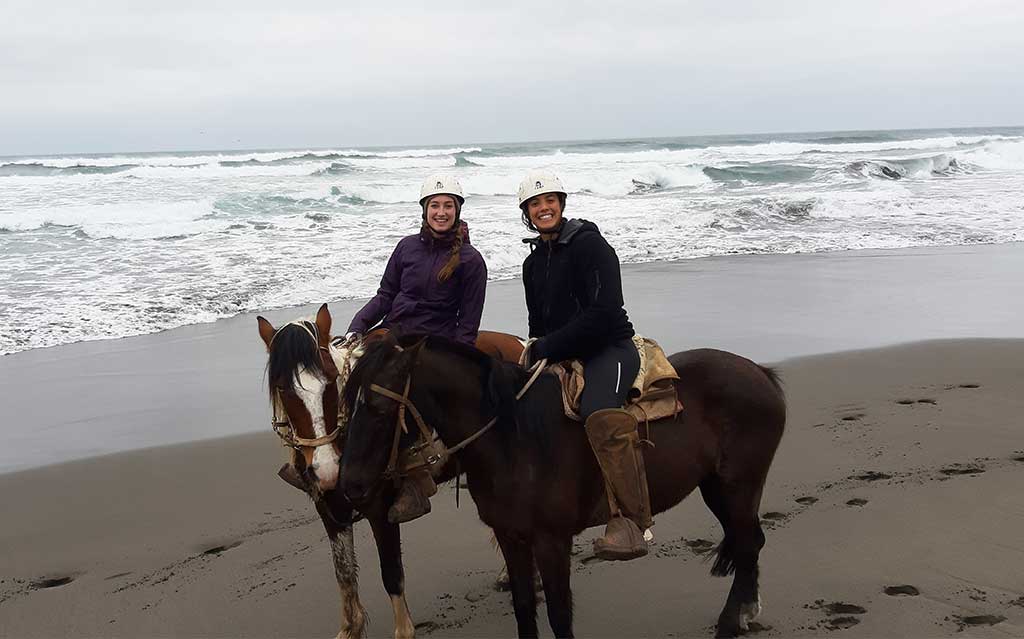 Guests having fun on beach horseback ride