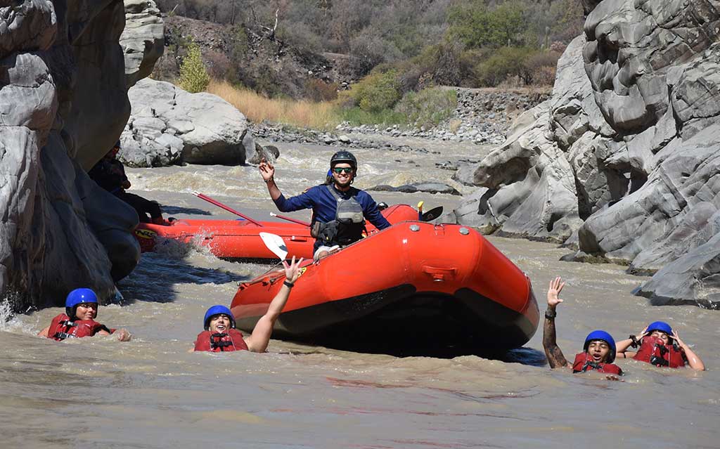 Taking a swim during the rafting adventure on the Maipo River