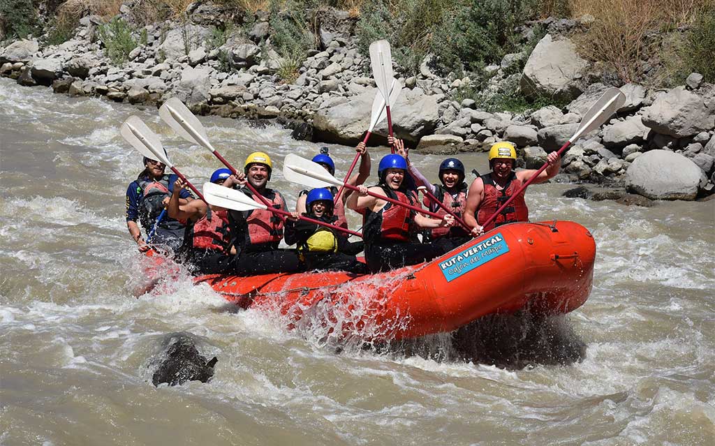 Happy guests while rafting on the Maipo River
