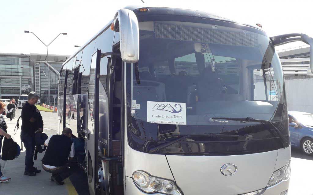 Modern bus for group tours at Santiago airport