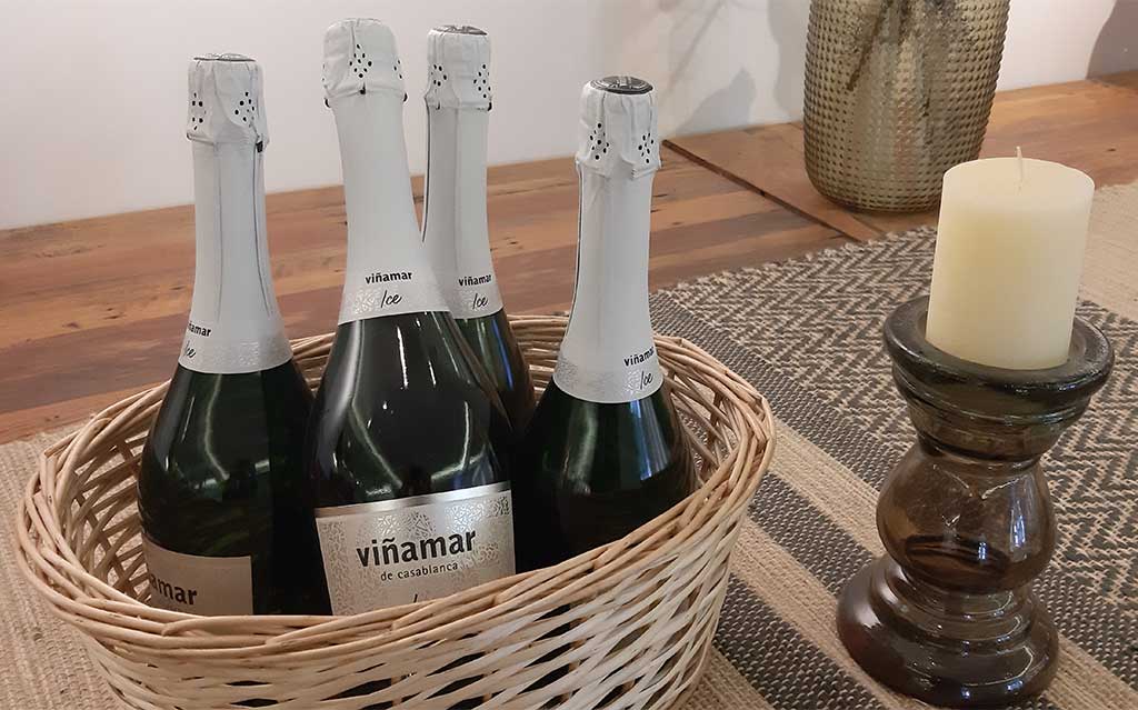 Sparking wine bottles and candle at Viñamar Vineyard